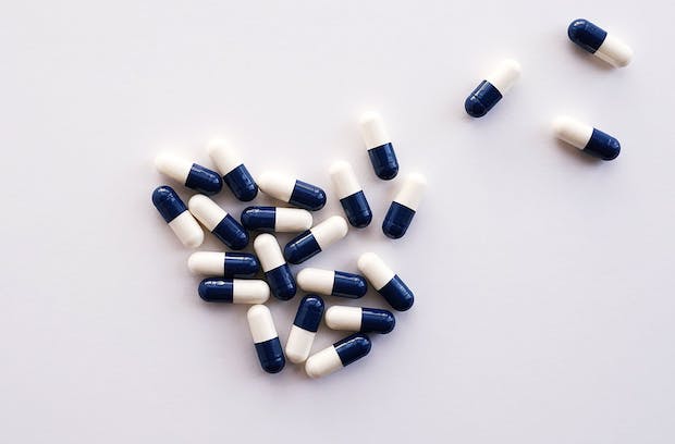 a pile of black and white tablets on a white background